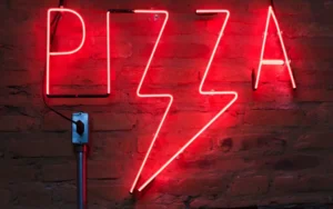 bold red neon sign for restaurant interior wall showcasing creative custom indoor signage for business
