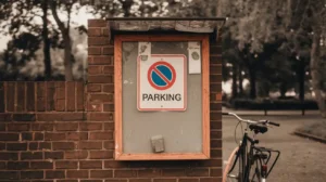 weatherproof notice board mounted on exterior brick wall ideal for outdoor public use