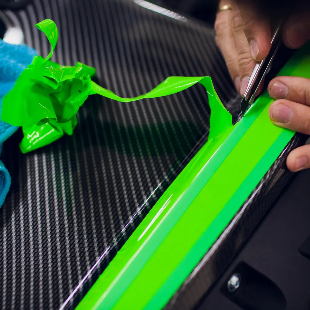 Precision vinyl wrap edge finishing, showing professional car wrap detailing for long-lasting results