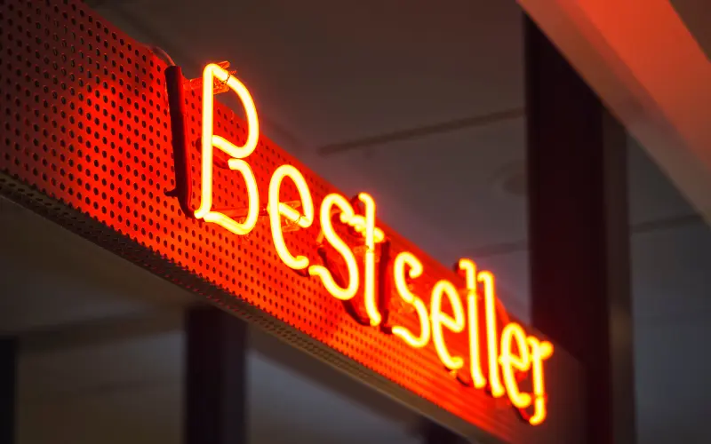 What is exterior signage demonstrated with illuminated shop front sign used to attract customers on high street
