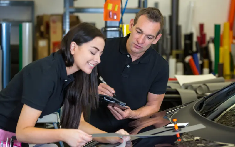 Do Car Wraps Damage Paintwork? The Truth About Vinyl Wrap Effects 3 Car wrap planning and quality inspection during a vinyl wrapping process, highlighting best practices for maintaining vehicle paintwork.