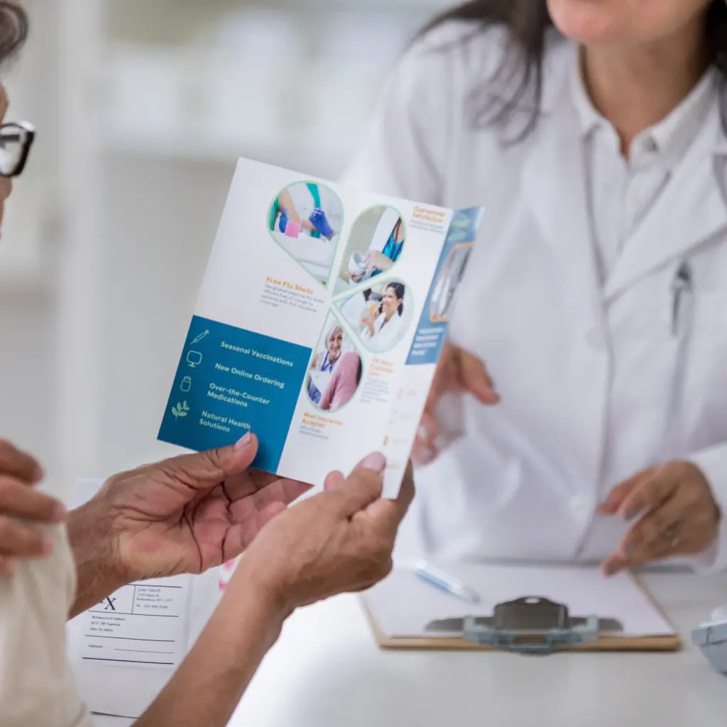 Difference between Brochures and Leaflets, and How Do They Compare to Flyers, Booklets, and Pamphlets 2 Healthcare leaflet being shared during a consultation, demonstrating how leaflets present key information clearly in a compact printed format.