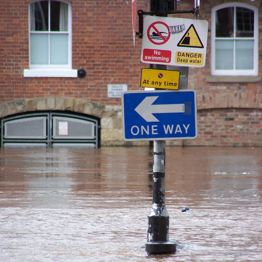 One way traffic sign with safety warning and directional signage system for road navigation